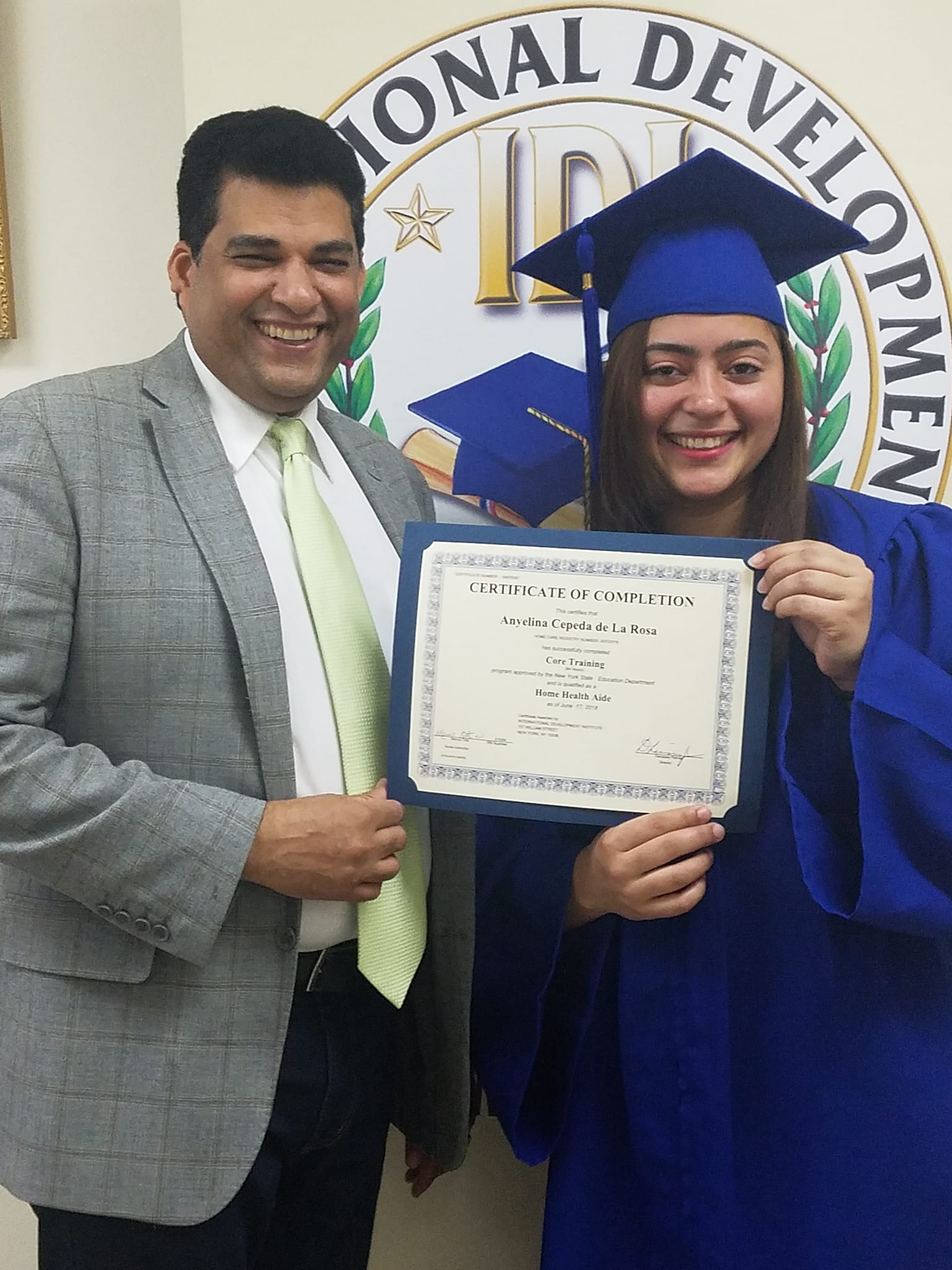 International Development Institute graduate celebrating with a family member